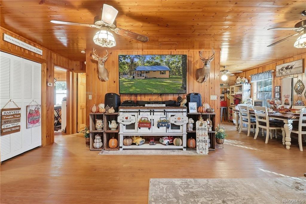 8110 Southwest 88th Lane Trenton, FL 32693 - Photo 10 of 29 a living room with furniture and a flat screen tv