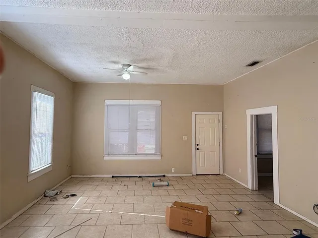 a view of an empty room and window