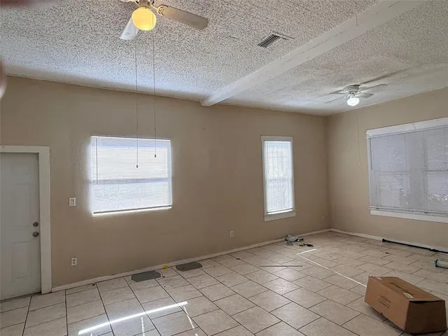 an empty room with windows