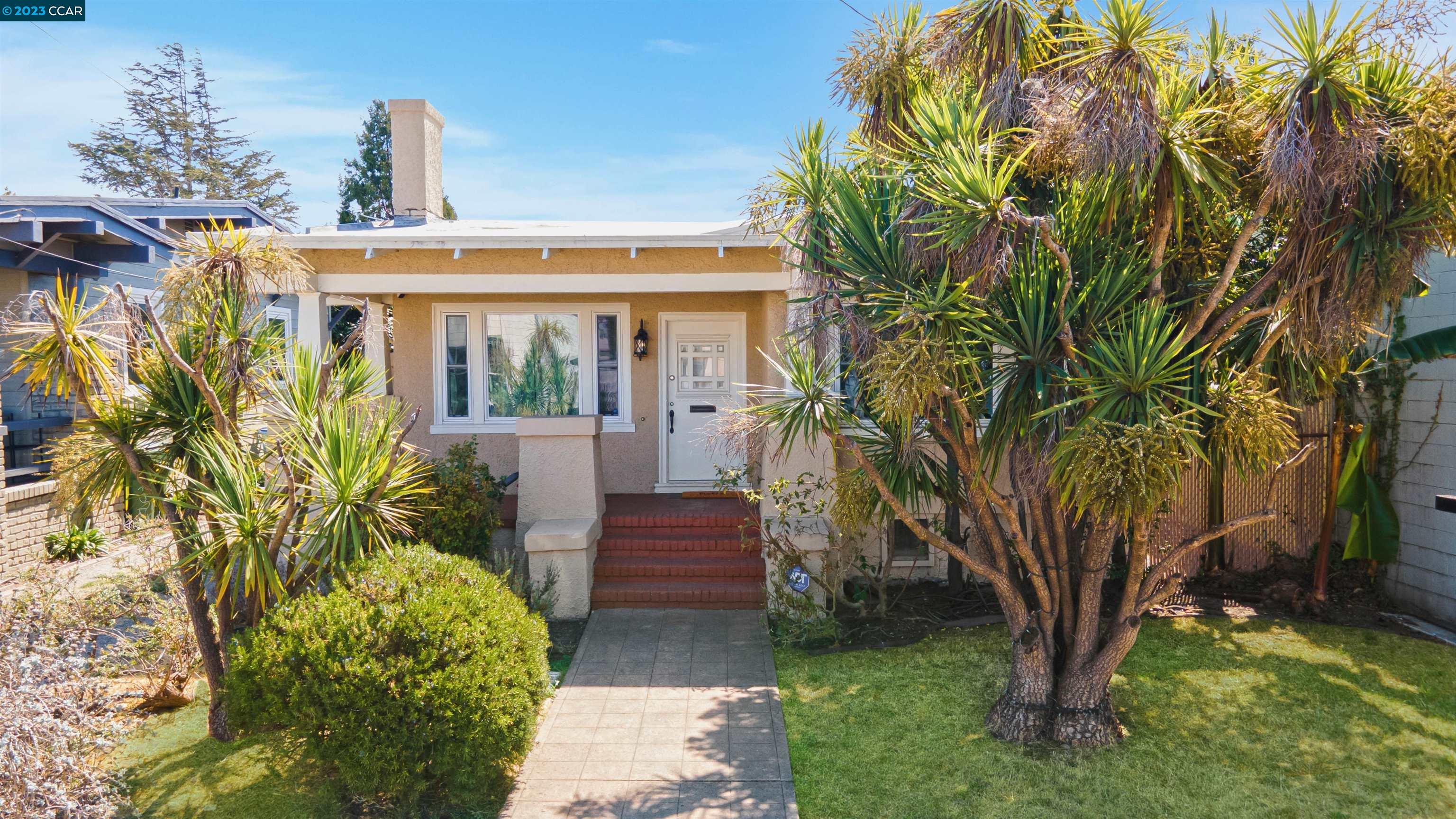 1090 Dwight Way Berkeley, CA 94710 - Photo 1 of 1 a view of a house with a yard and potted plants