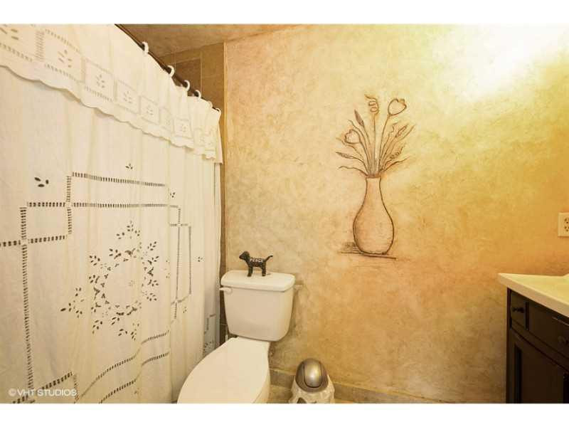10139 Windtree Lane Boca Raton, FL 33428 - Photo 3 of 15 a bathroom with a toilet and shower
