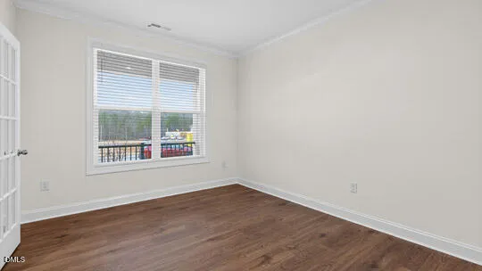 a kitchen with stainless steel appliances granite countertop a refrigerator a sink and white cabinets
