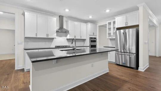 a kitchen with stainless steel appliances a sink stove and cabinets