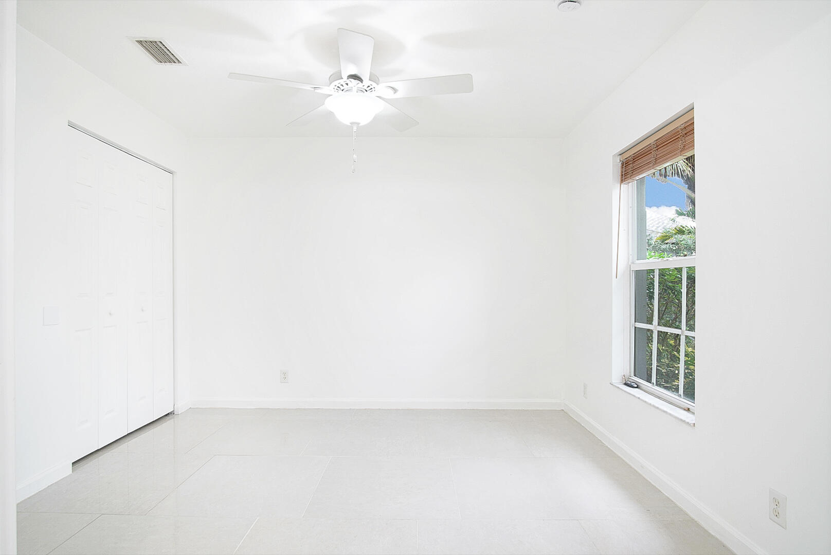 4483 Southeast Murray Cove Circle Stuart, FL 34997 - Photo 17 of 21 an empty room with a window