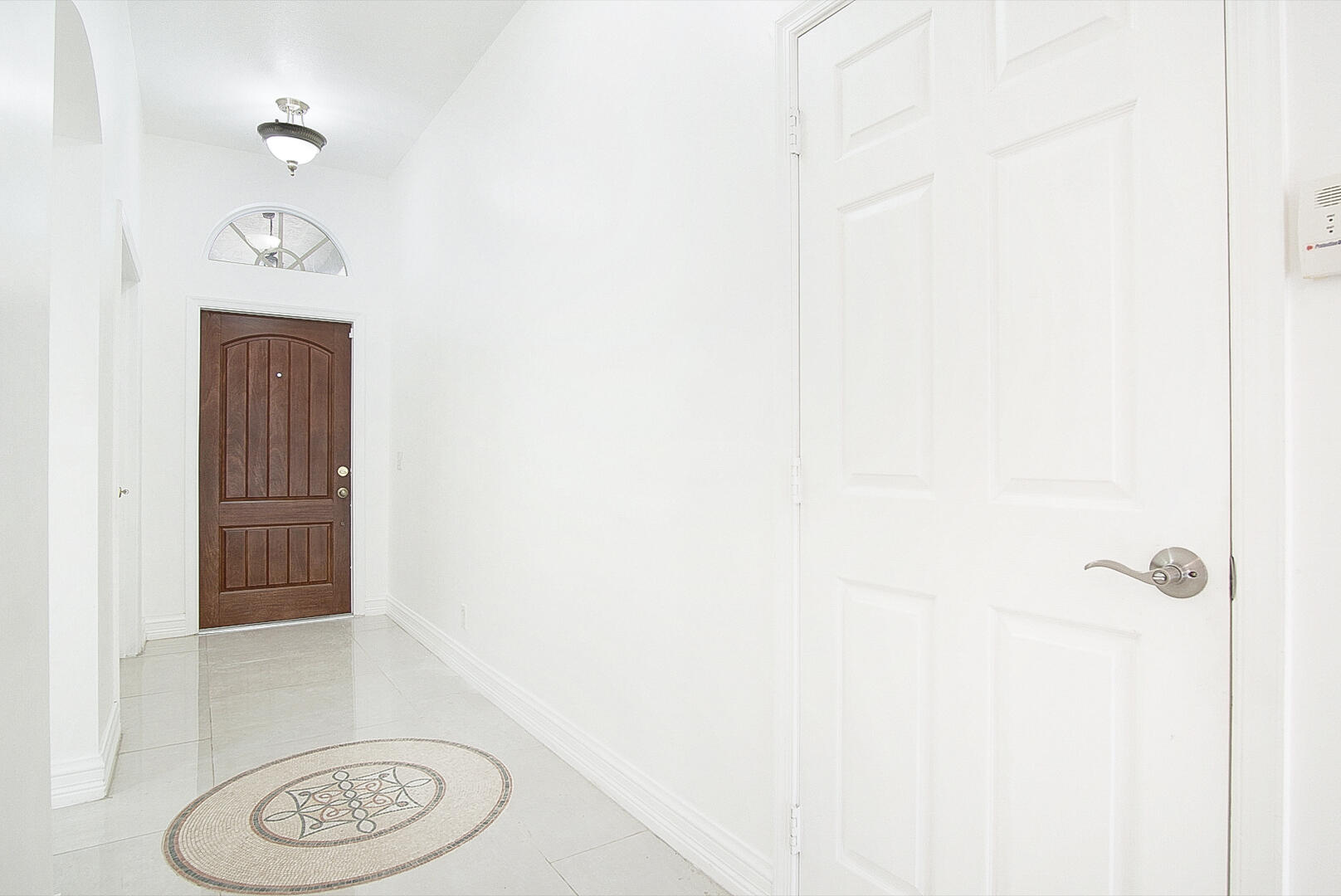 4483 Southeast Murray Cove Circle Stuart, FL 34997 - Photo 5 of 21 a bathroom with a toilet and a shower curtain