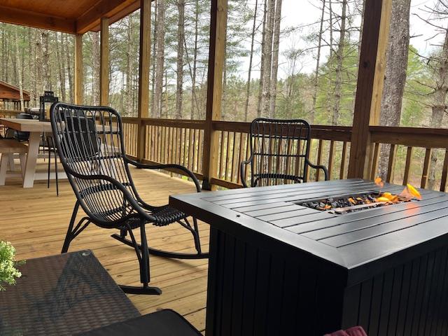 331 Vineyard Creek Way Murphy, NC 28906 - Photo 15 of 43 a view of a balcony dining area with furniture