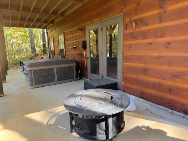 a view of back yard with patio