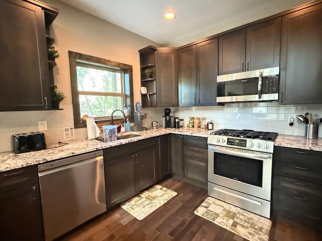 331 Vineyard Creek Way Murphy, NC 28906 - Photo 9 of 43 a kitchen with stainless steel appliances kitchen island granite countertop a sink stove and microwave