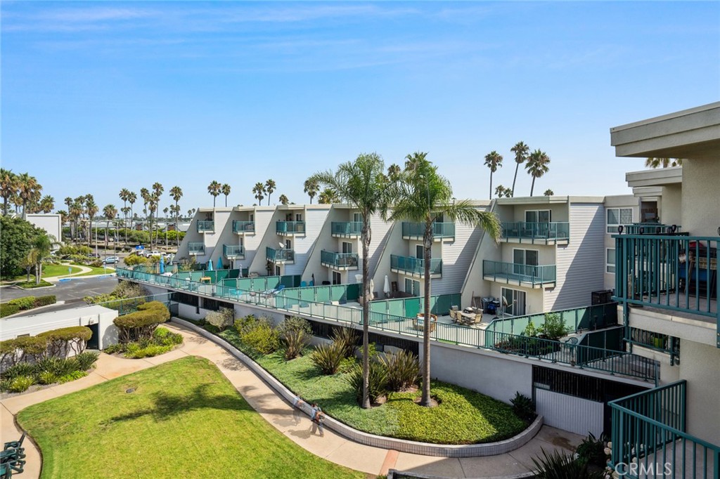 3101 Peninsula Road, Unit 310 Oxnard, CA 93035 - Photo 1 of 1 a view of a swimming pool with outdoor seating