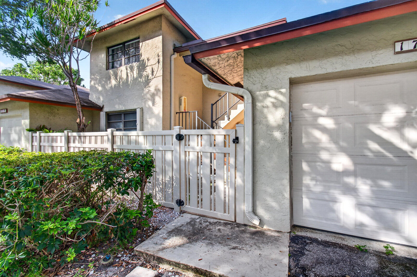 3951 Northeast 19th Road, Unit 1701 Pompano Beach, FL 33064 - Photo 69 of 82 a front view of a house with a yard