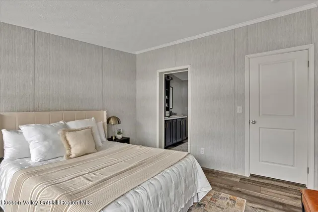 a bedroom with a bed and a closet