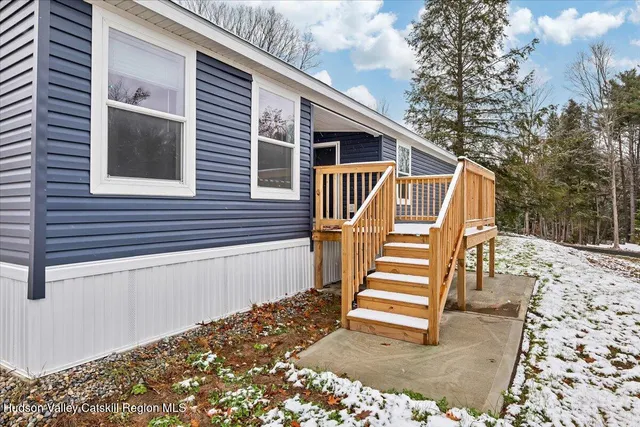 a view of a house with backyard and stairs