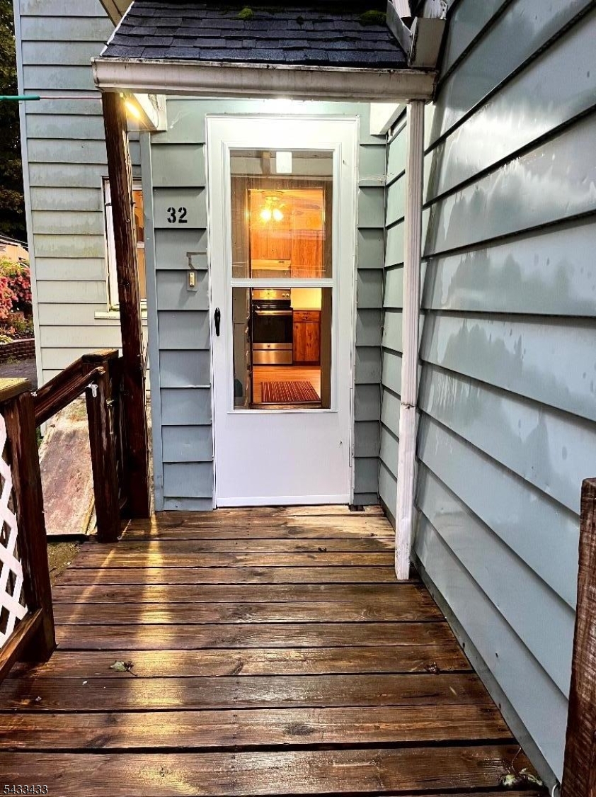 30 Fowler Street Franklin, NJ 07416 - Photo 5 of 27 a view of room with door and wooden floor