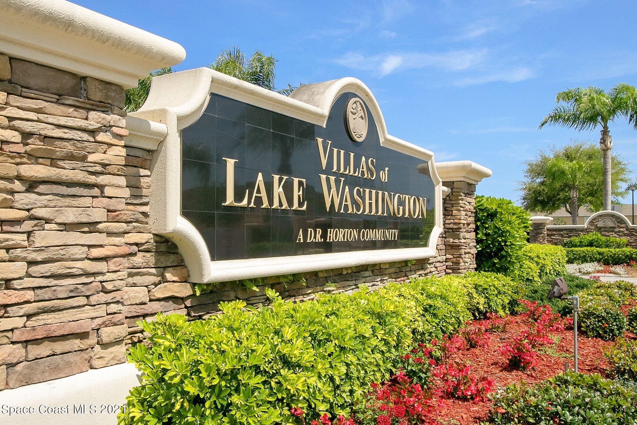 2780 Reston Street, Unit 102 Melbourne, FL 32935 - Photo 32 of 36 a view of a sign board with buildings in background