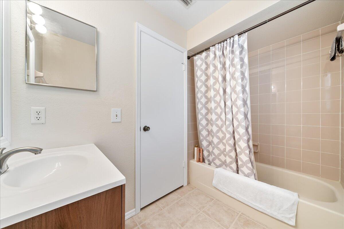 714 Players Court Melbourne, FL 32940 - Photo 16 of 23 a bathroom with a sink a toilet and shower