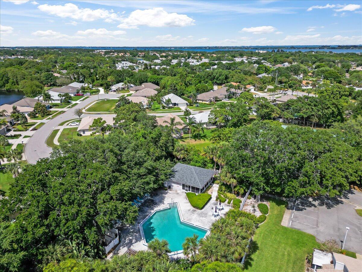 714 Players Court Melbourne, FL 32940 - Photo 22 of 23 an aerial view of residential houses with outdoor space and trees
