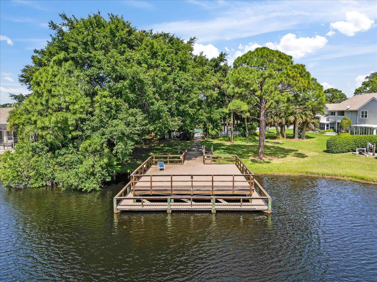714 Players Court Melbourne, FL 32940 - Photo 23 of 23 a view of a swimming pool with a yard and large trees
