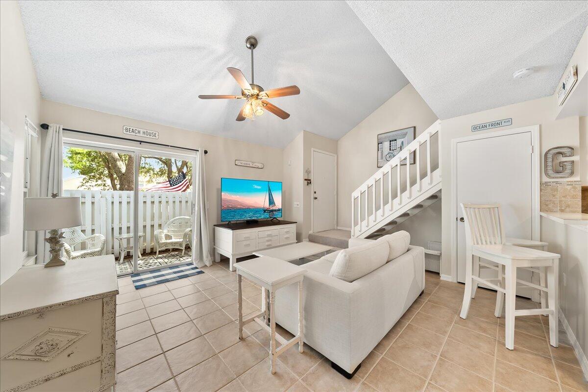 714 Players Court Melbourne, FL 32940 - Photo 4 of 23 a living room with furniture and a flat screen tv