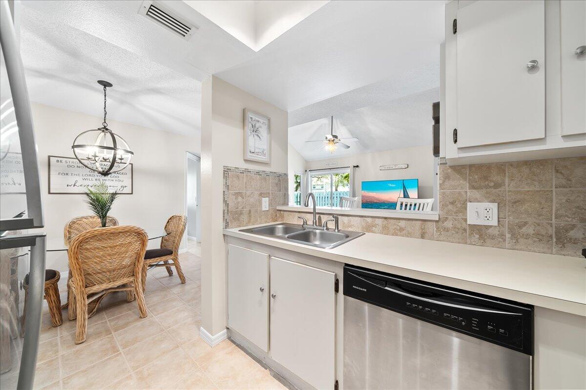 714 Players Court Melbourne, FL 32940 - Photo 8 of 23 a kitchen with a sink cabinets and window