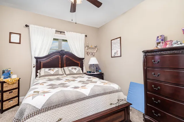 a bedroom with a bed and a dresser