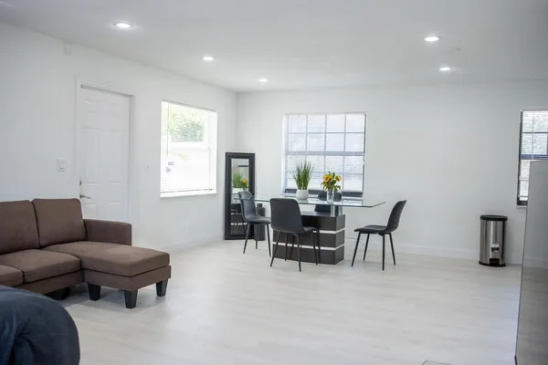 a living room with furniture and a window