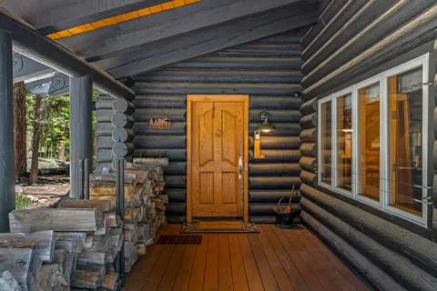 a view of outdoor space with wooden floor and windows