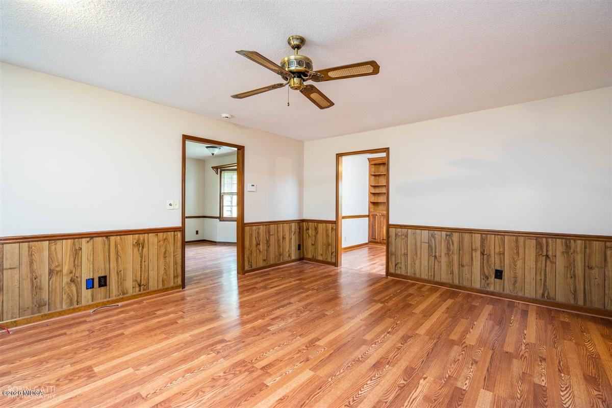 6345 Stapleton Road Macon, GA 31206 - Photo 11 of 21 a view of empty room with wooden floor and fan