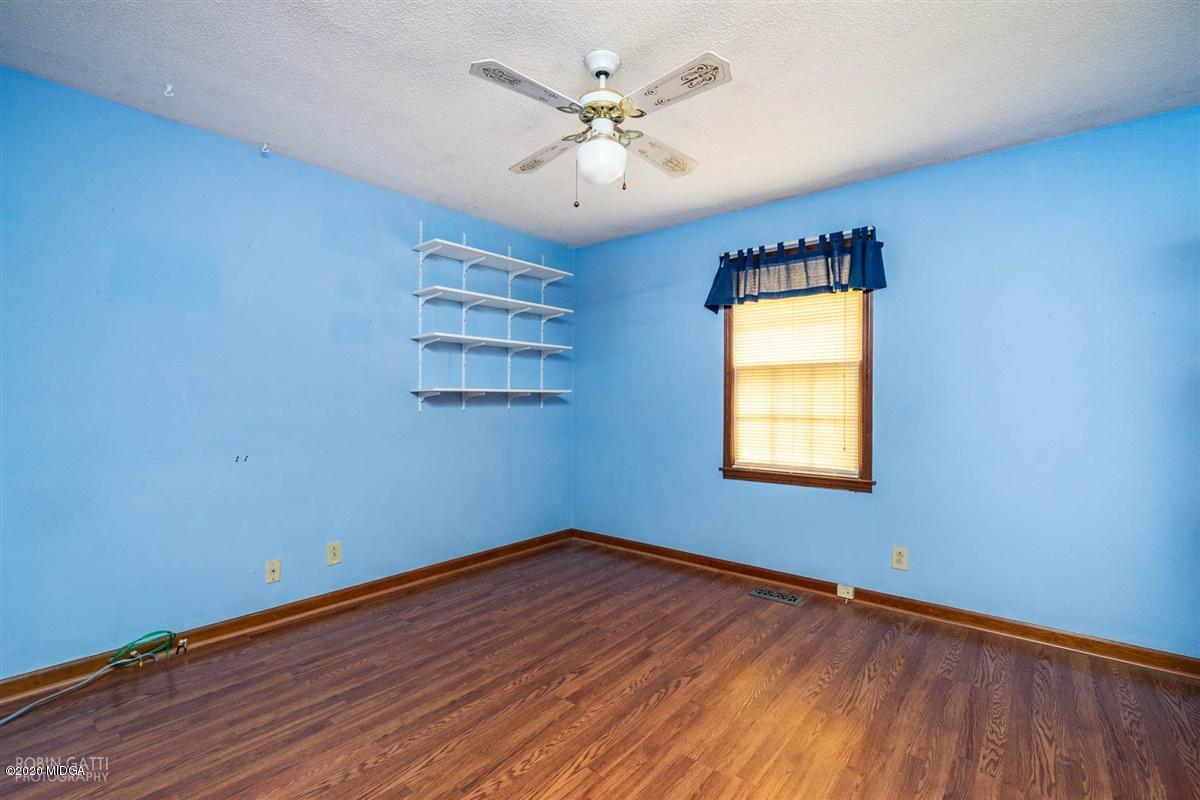 6345 Stapleton Road Macon, GA 31206 - Photo 15 of 21 wooden floor in an empty room with a window