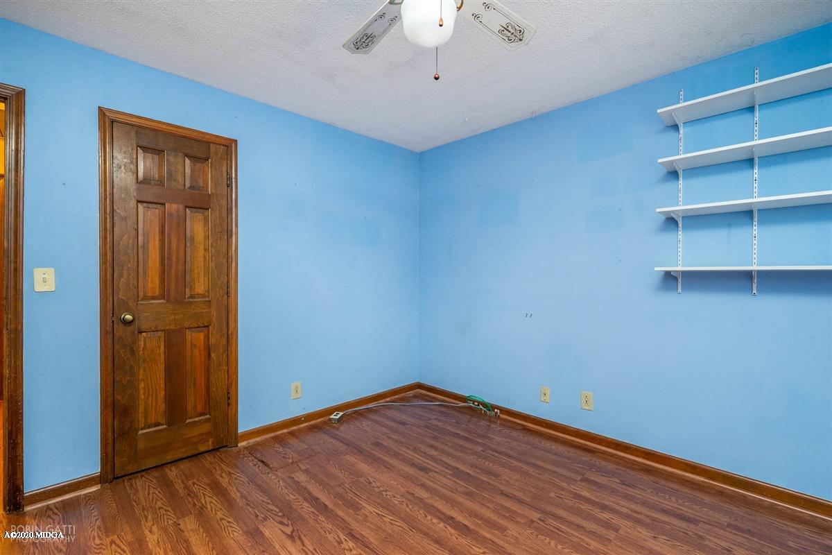 6345 Stapleton Road Macon, GA 31206 - Photo 16 of 21 a view of empty room with wooden floor and cabinet