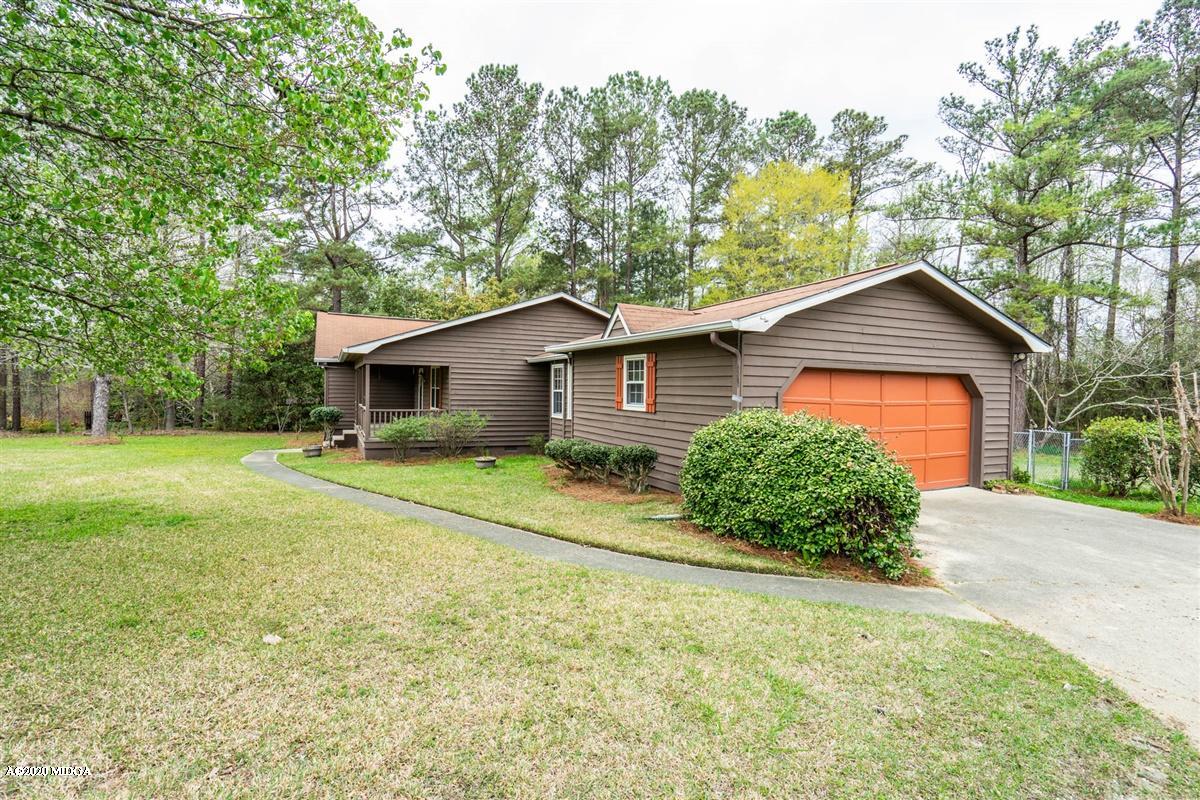 6345 Stapleton Road Macon, GA 31206 - Photo 20 of 21 a view of a house with a yard and large trees