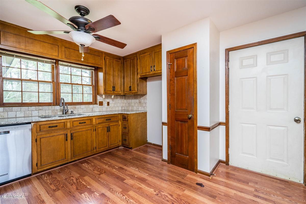 6345 Stapleton Road Macon, GA 31206 - Photo 6 of 21 a kitchen with stainless steel appliances granite countertop a refrigerator and a sink