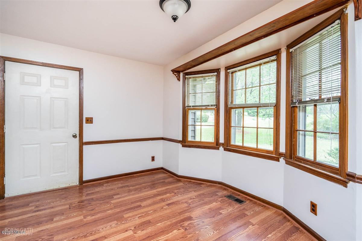 6345 Stapleton Road Macon, GA 31206 - Photo 8 of 21 wooden floor in an empty room with a window