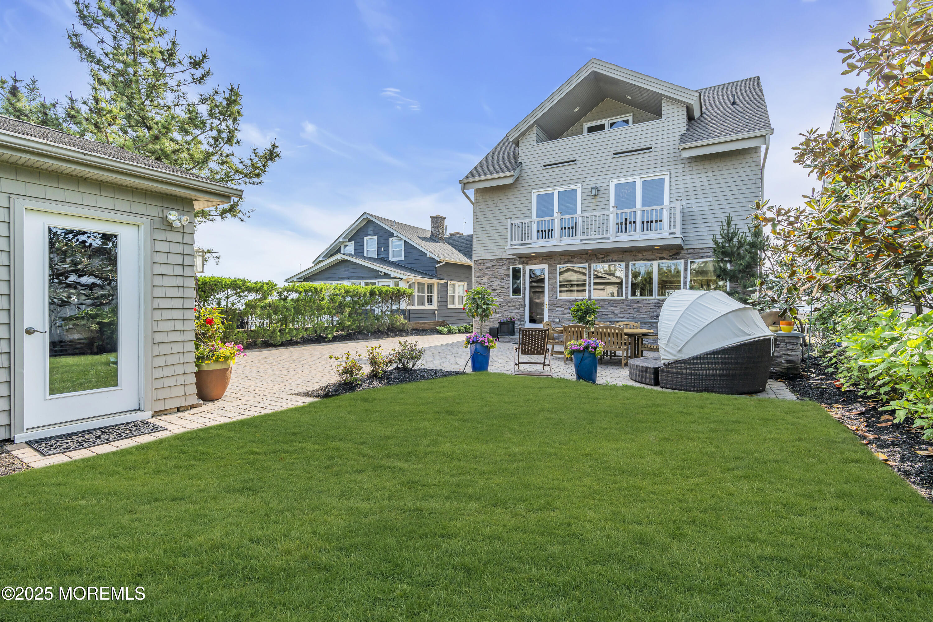 2009 North Ocean Avenue Spring Lake, NJ 07762 - Photo 16 of 91 a view of a house with a yard deck and sitting area