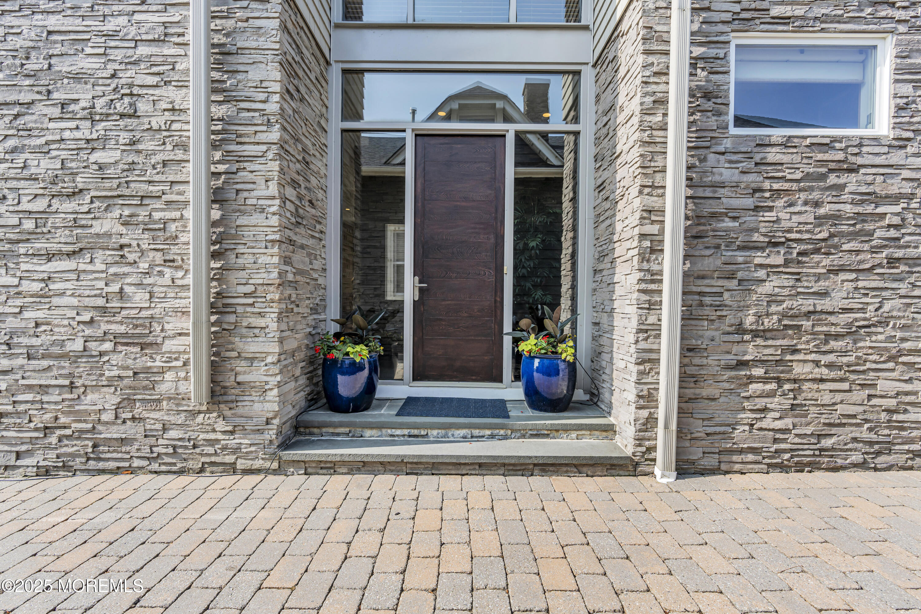 2009 North Ocean Avenue Spring Lake, NJ 07762 - Photo 17 of 91 a view of a brick house with an outdoor space