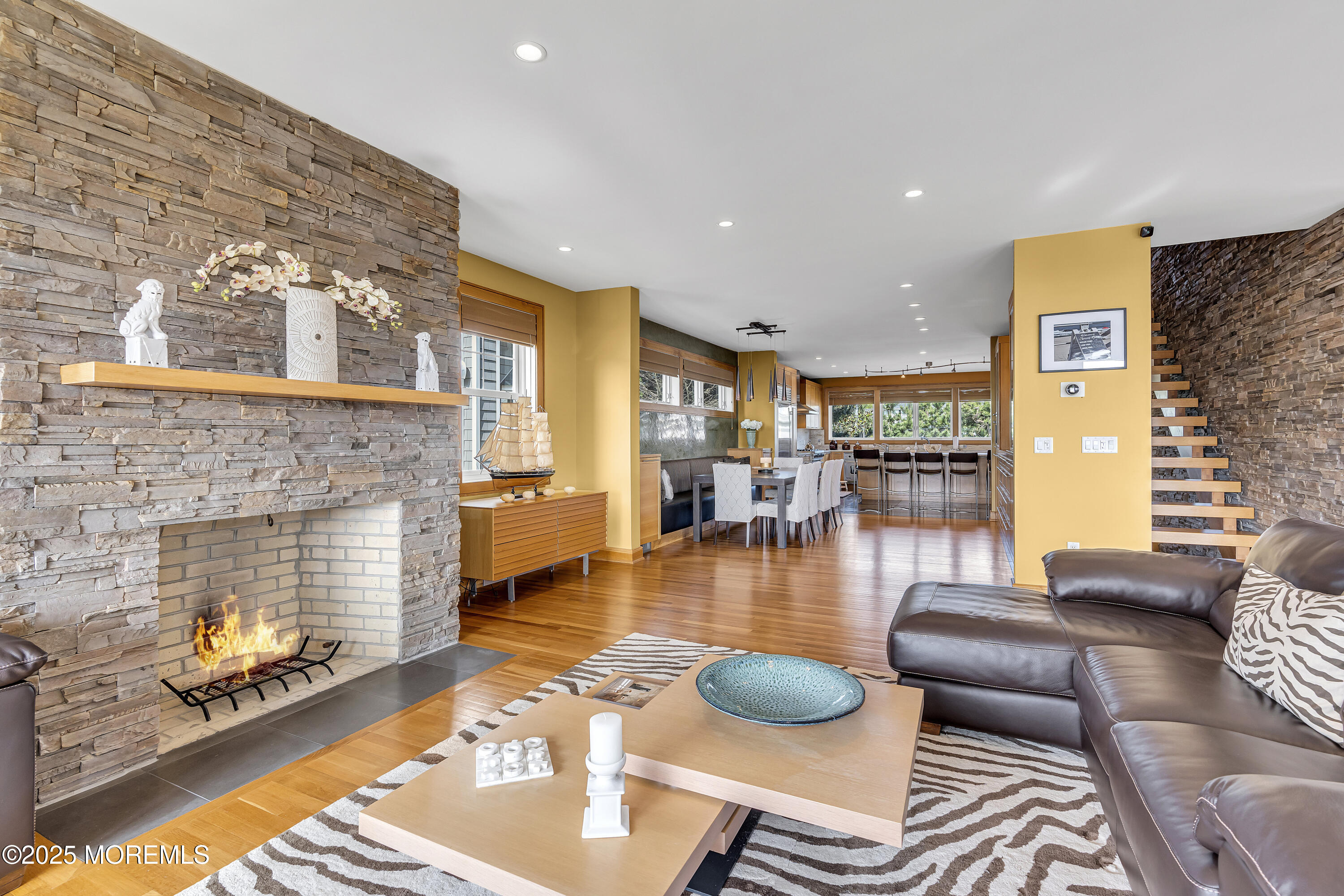2009 North Ocean Avenue Spring Lake, NJ 07762 - Photo 21 of 91 a living room with furniture and a fireplace with wooden floor