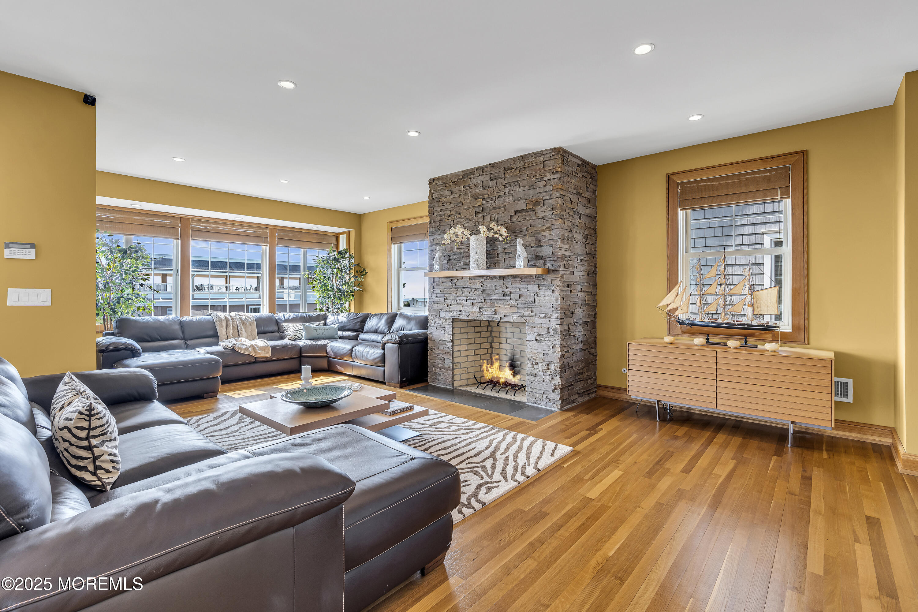 2009 North Ocean Avenue Spring Lake, NJ 07762 - Photo 23 of 91 a living room with furniture and a fireplace