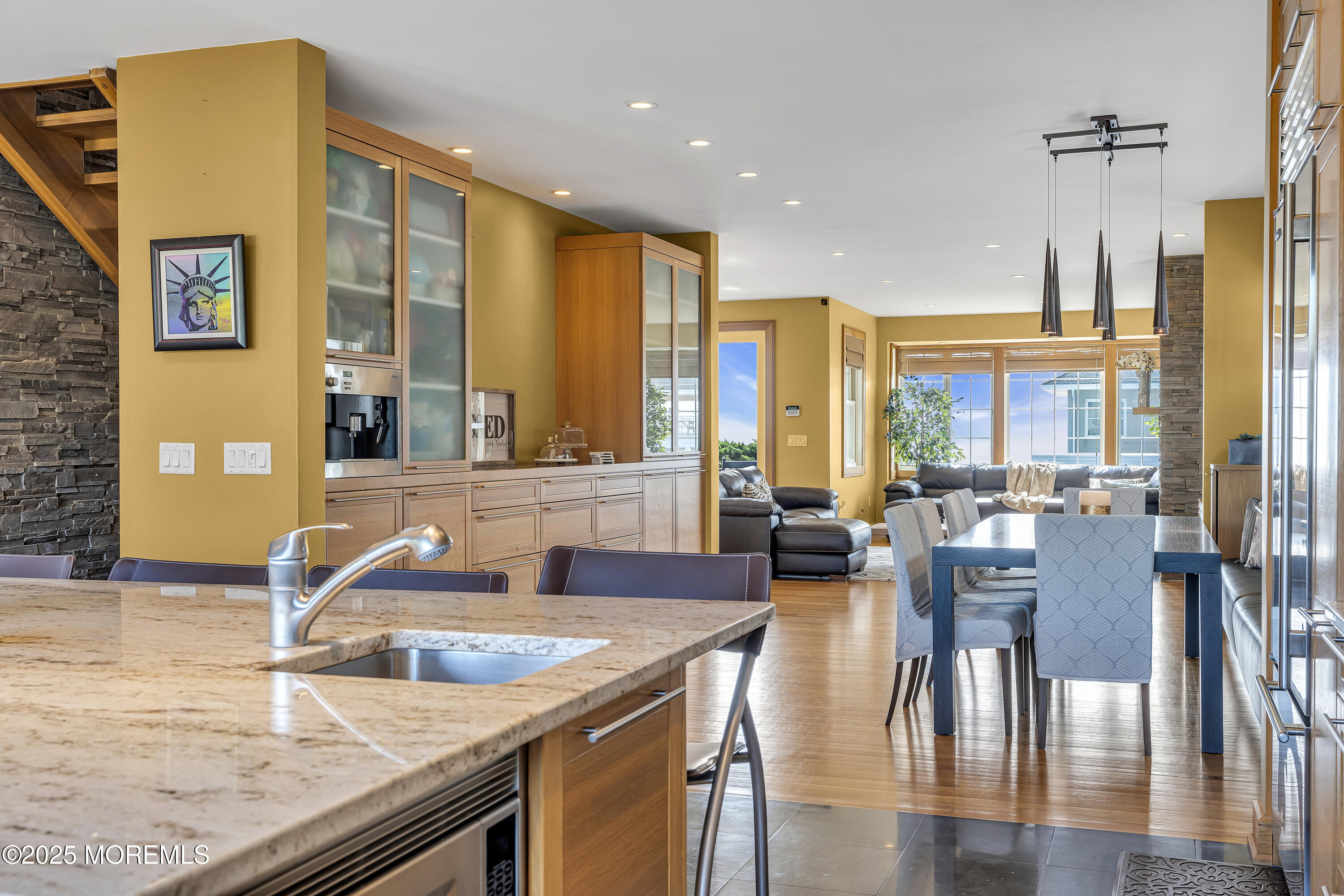 2009 North Ocean Avenue Spring Lake, NJ 07762 - Photo 25 of 91 a kitchen with stainless steel appliances granite countertop a table chairs and a large window