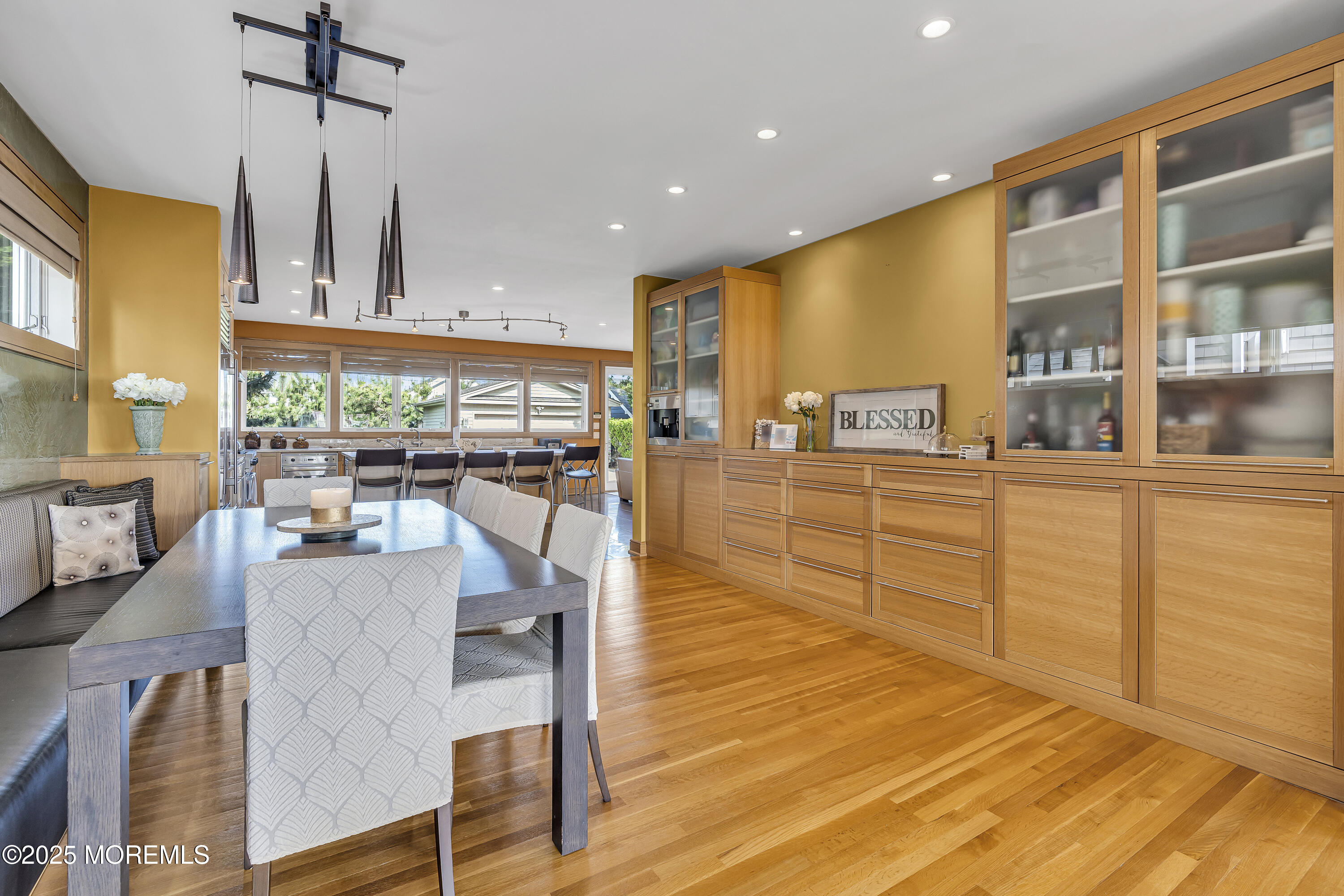 2009 North Ocean Avenue Spring Lake, NJ 07762 - Photo 31 of 91 a living room with stainless steel appliances kitchen island granite countertop a table chairs and a view of living room