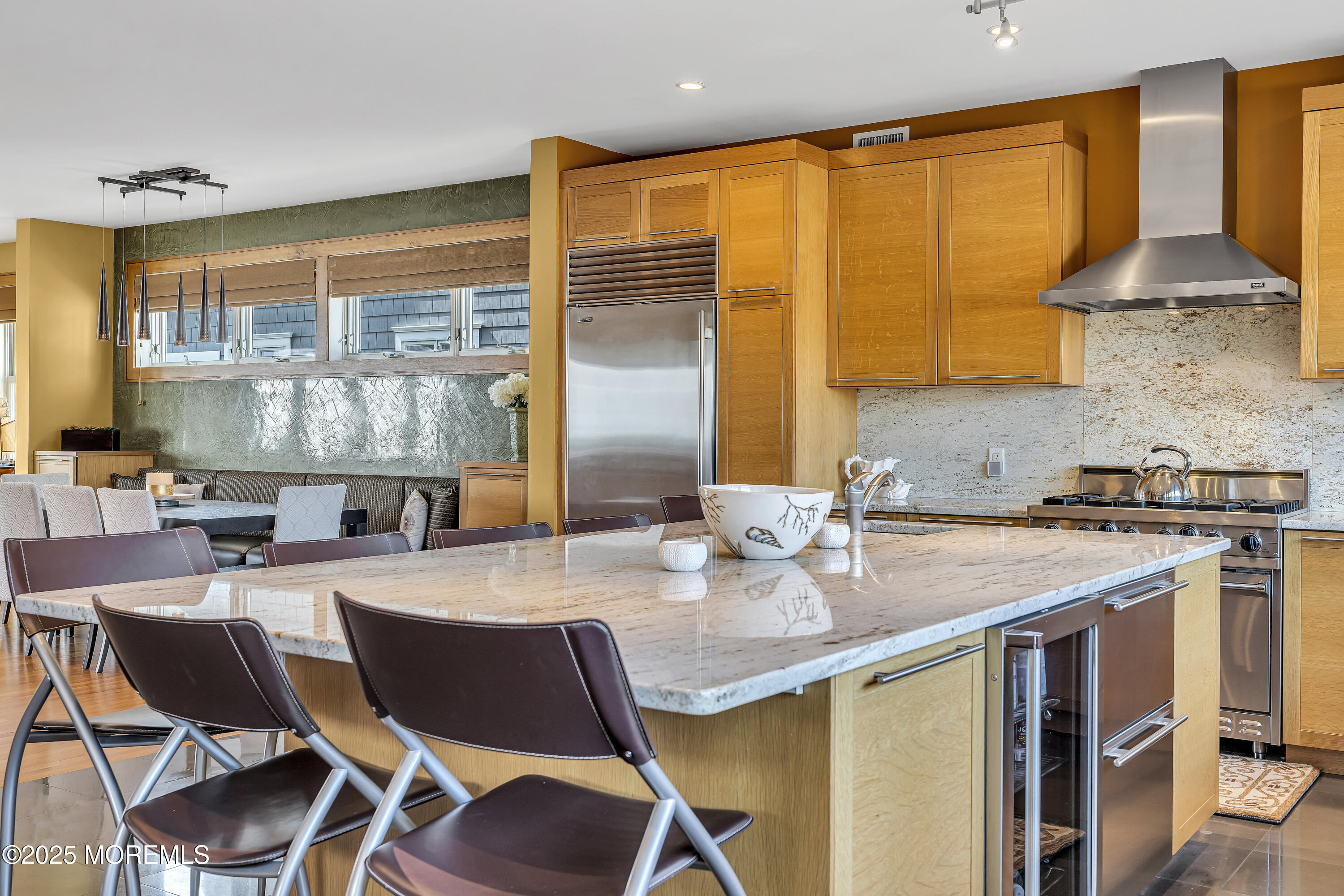 2009 North Ocean Avenue Spring Lake, NJ 07762 - Photo 34 of 91 a kitchen with a stove a sink and a dining table