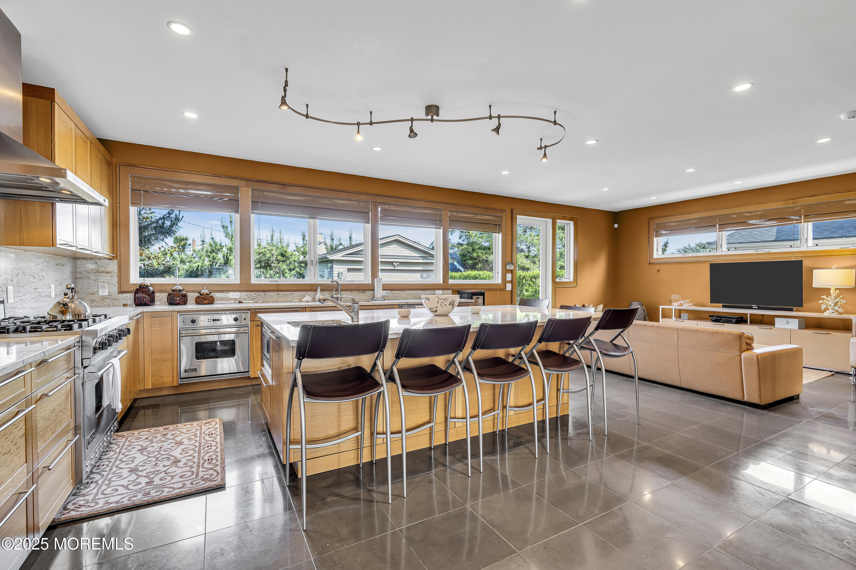 2009 North Ocean Avenue Spring Lake, NJ 07762 - Photo 38 of 91 a dining hall with stainless steel appliances kitchen island granite countertop a table and chairs