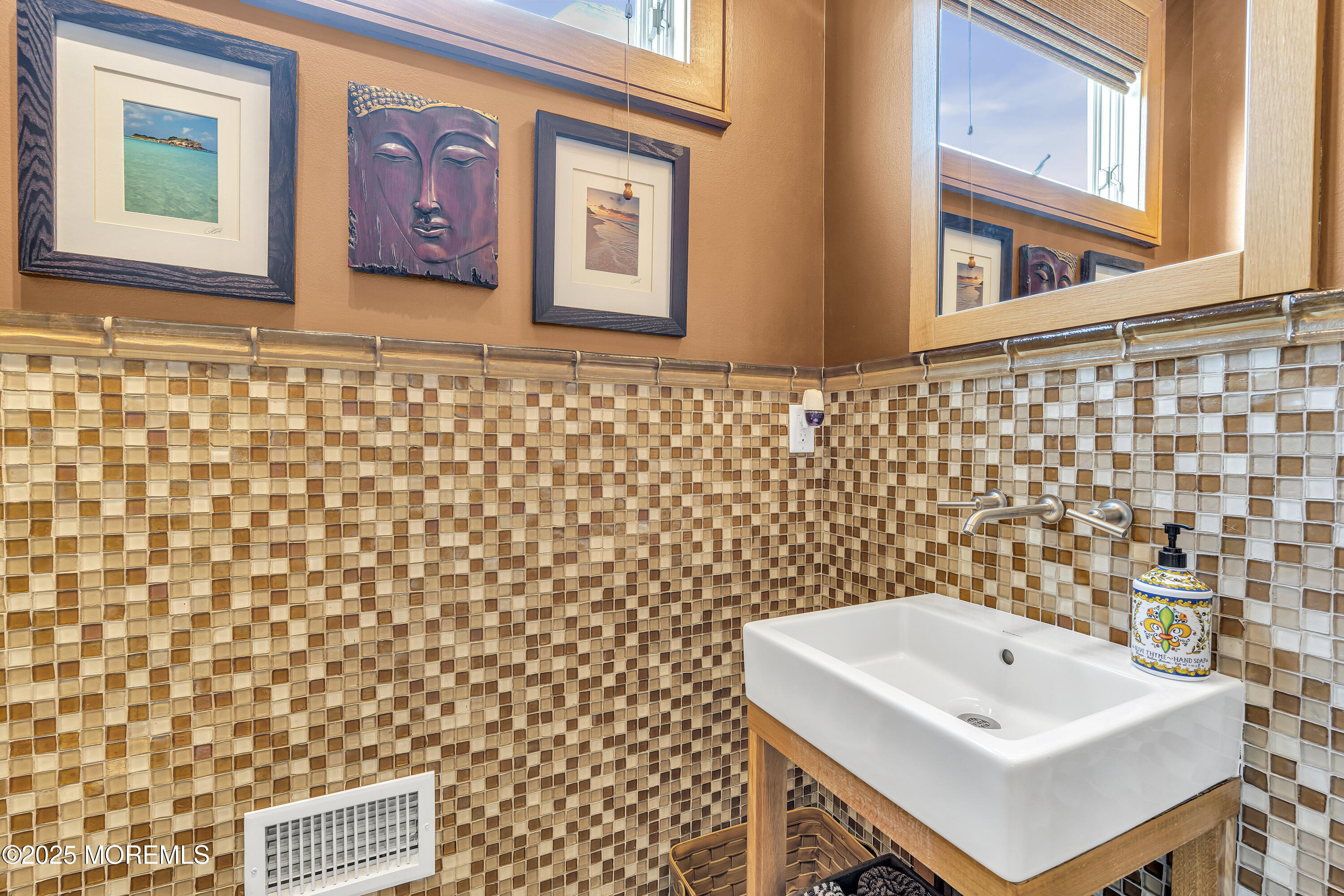 2009 North Ocean Avenue Spring Lake, NJ 07762 - Photo 41 of 91 a bathroom with a sink and a mirror