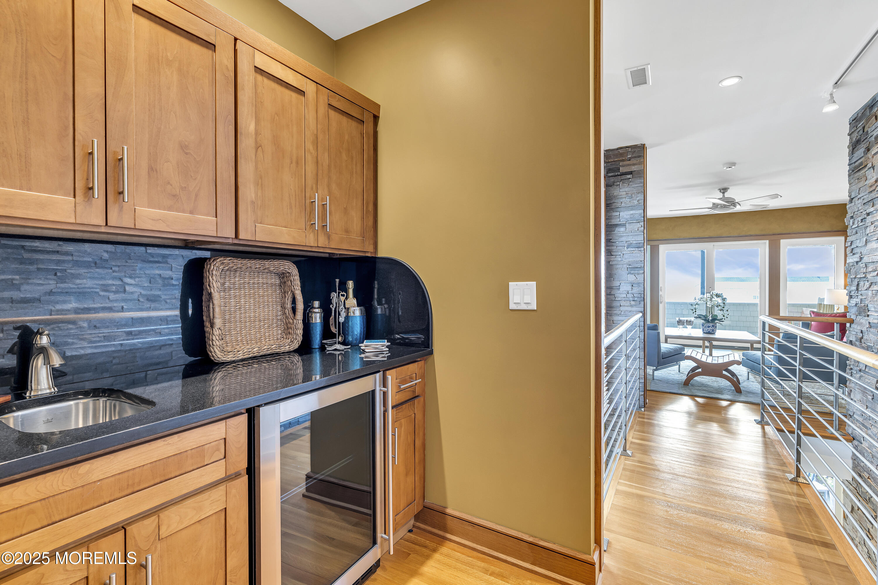 2009 North Ocean Avenue Spring Lake, NJ 07762 - Photo 44 of 91 a kitchen with stainless steel appliances granite countertop a refrigerator a sink dishwasher and wooden cabinets with wooden floor