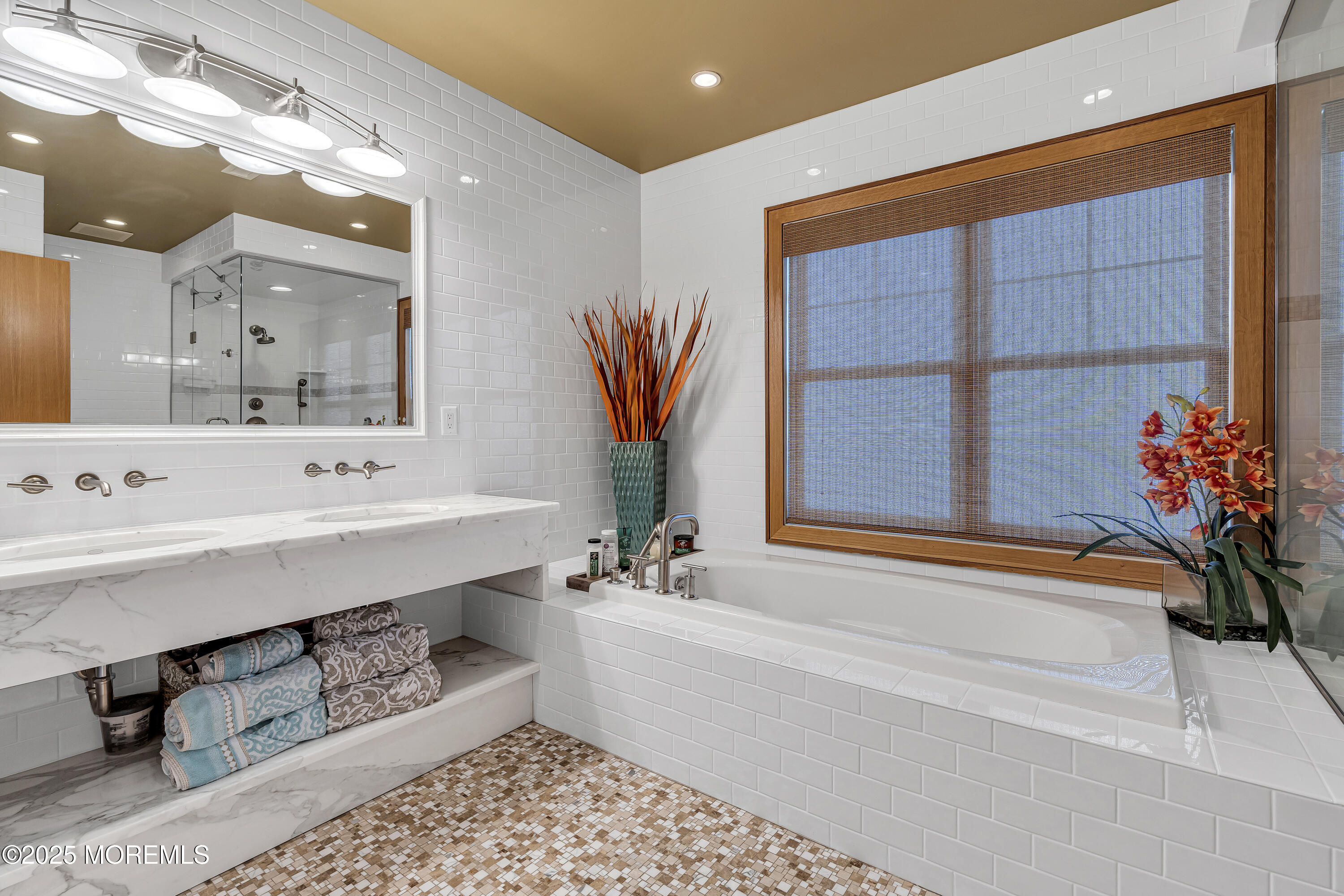 2009 North Ocean Avenue Spring Lake, NJ 07762 - Photo 49 of 91 a bathroom with a bathtub a sink and a window