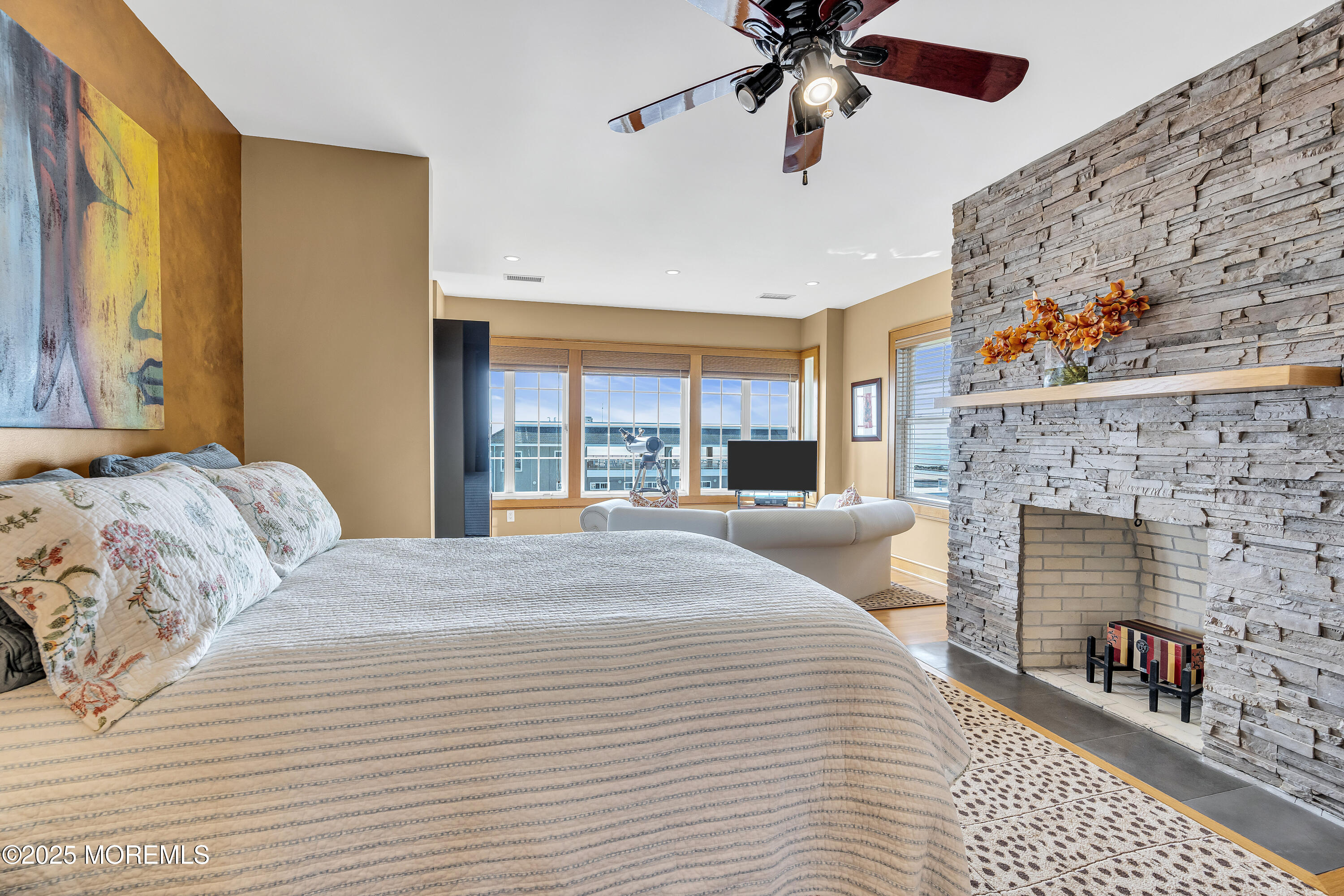 2009 North Ocean Avenue Spring Lake, NJ 07762 - Photo 50 of 91 a bedroom with a bed and a fireplace