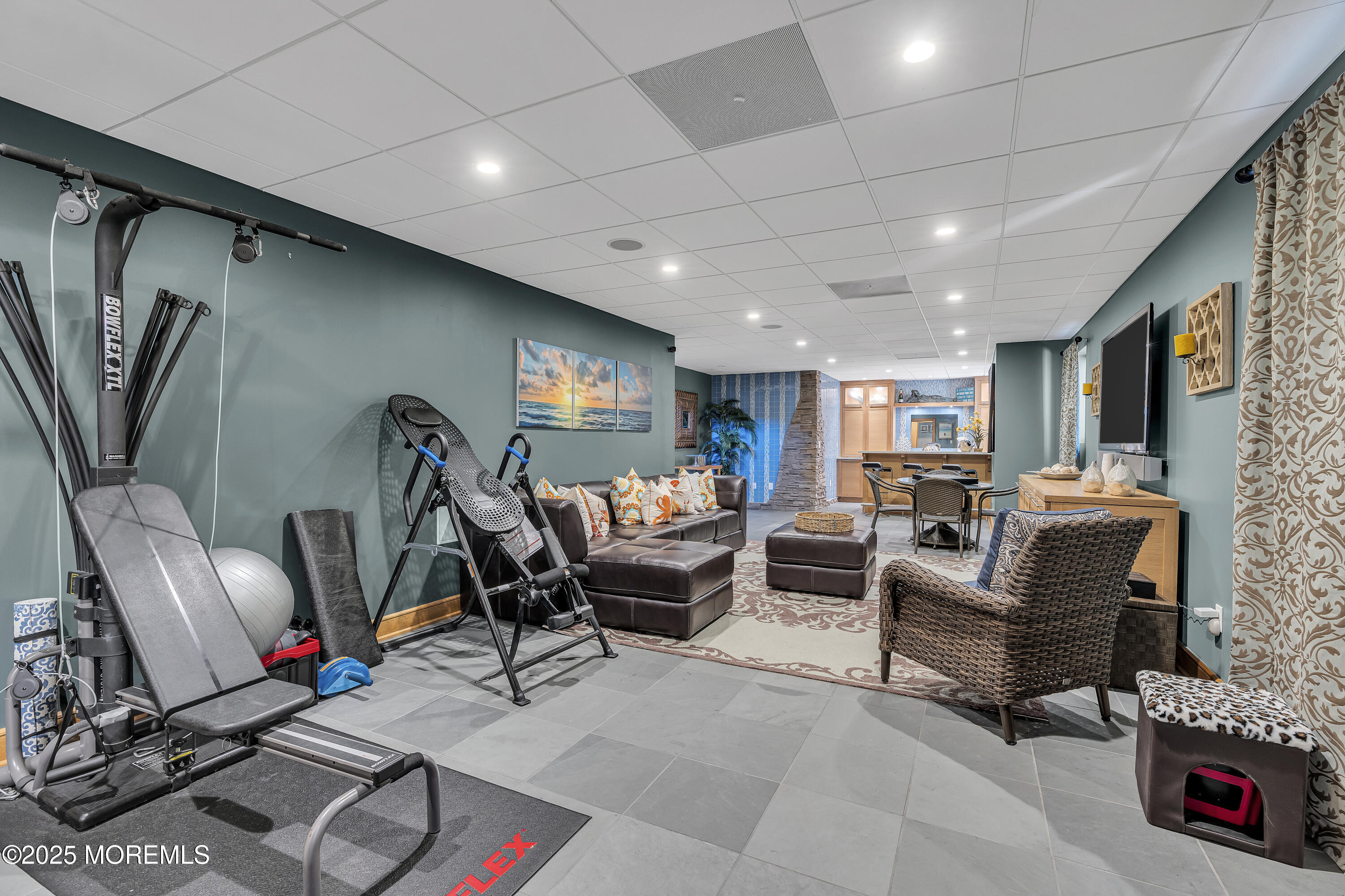 2009 North Ocean Avenue Spring Lake, NJ 07762 - Photo 78 of 91 a living room with furniture a flat screen tv and a table