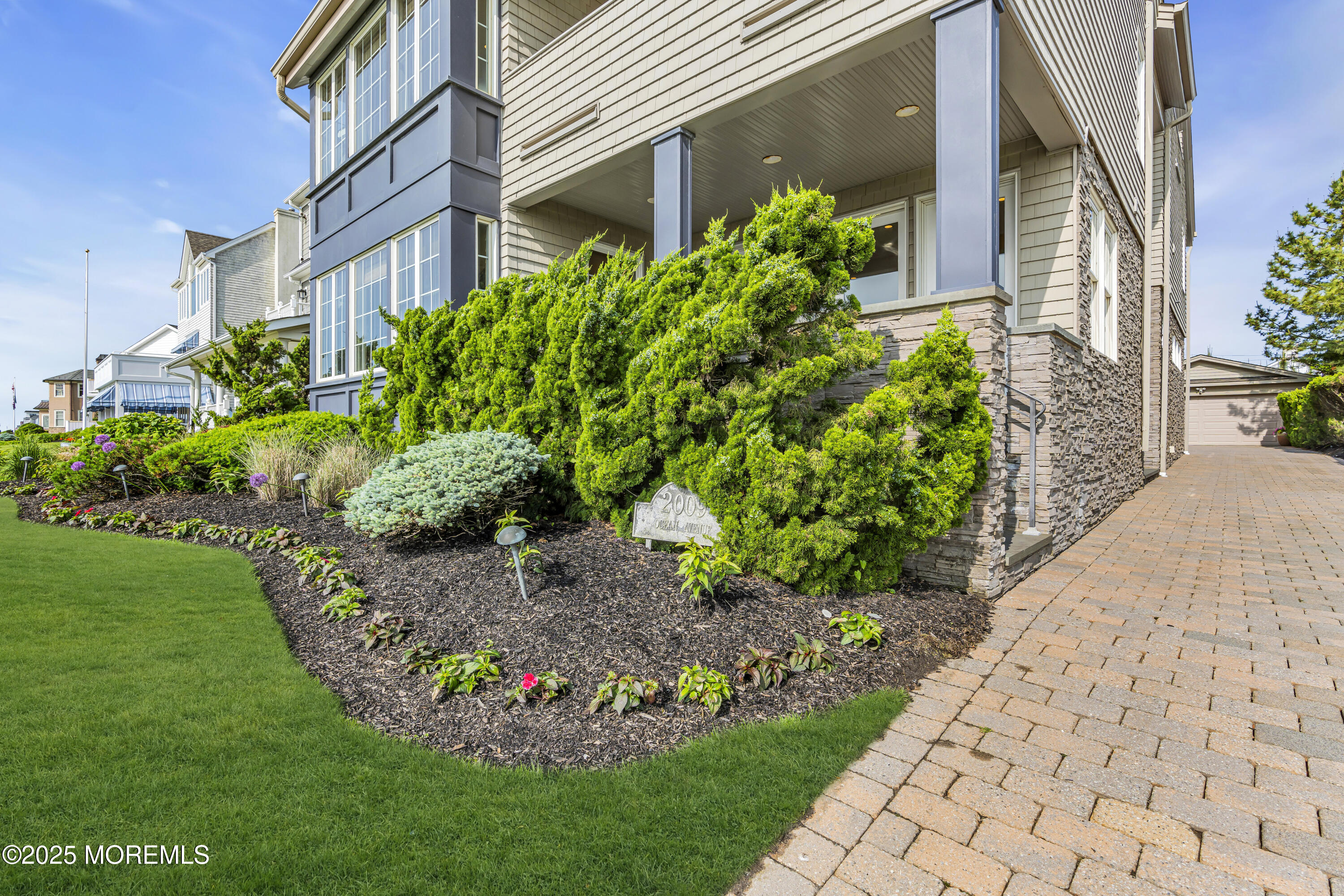 2009 North Ocean Avenue Spring Lake, NJ 07762 - Photo 8 of 91 a view of a garden with pathway