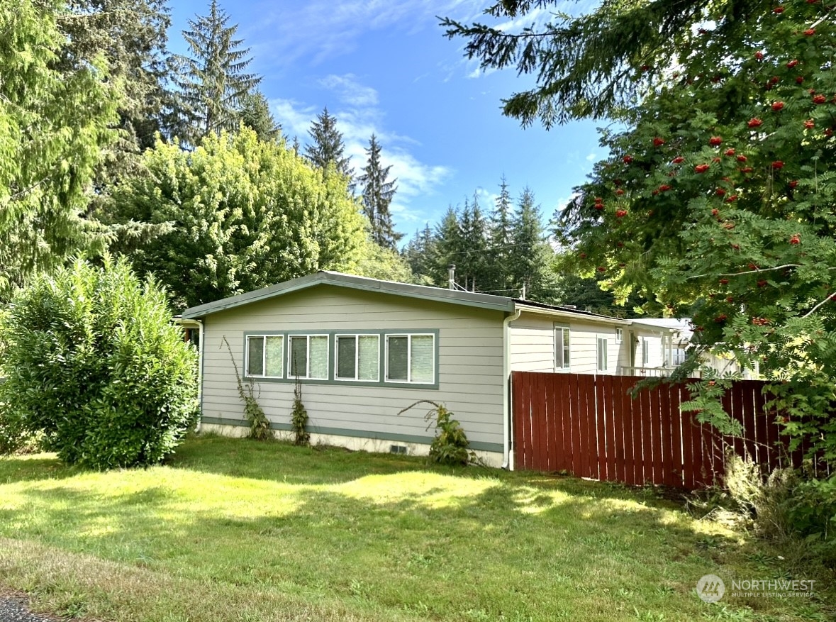 230 Salmon Drive Forks, WA 98331 - Photo 1 of 35 a front view of a house with yard and green space