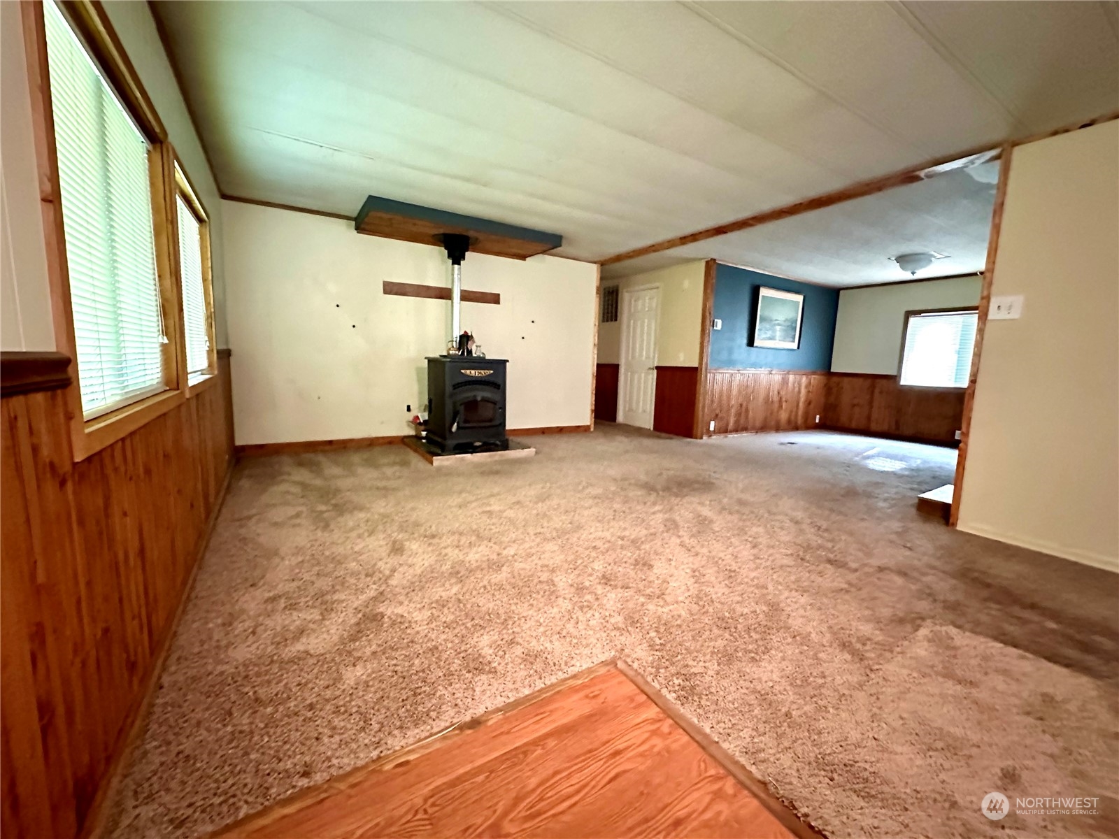 230 Salmon Drive Forks, WA 98331 - Photo 13 of 35 a view of an empty room with window and a fireplace