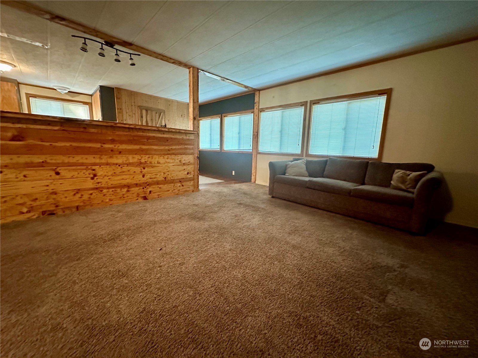 230 Salmon Drive Forks, WA 98331 - Photo 16 of 35 a living room with furniture and a large window