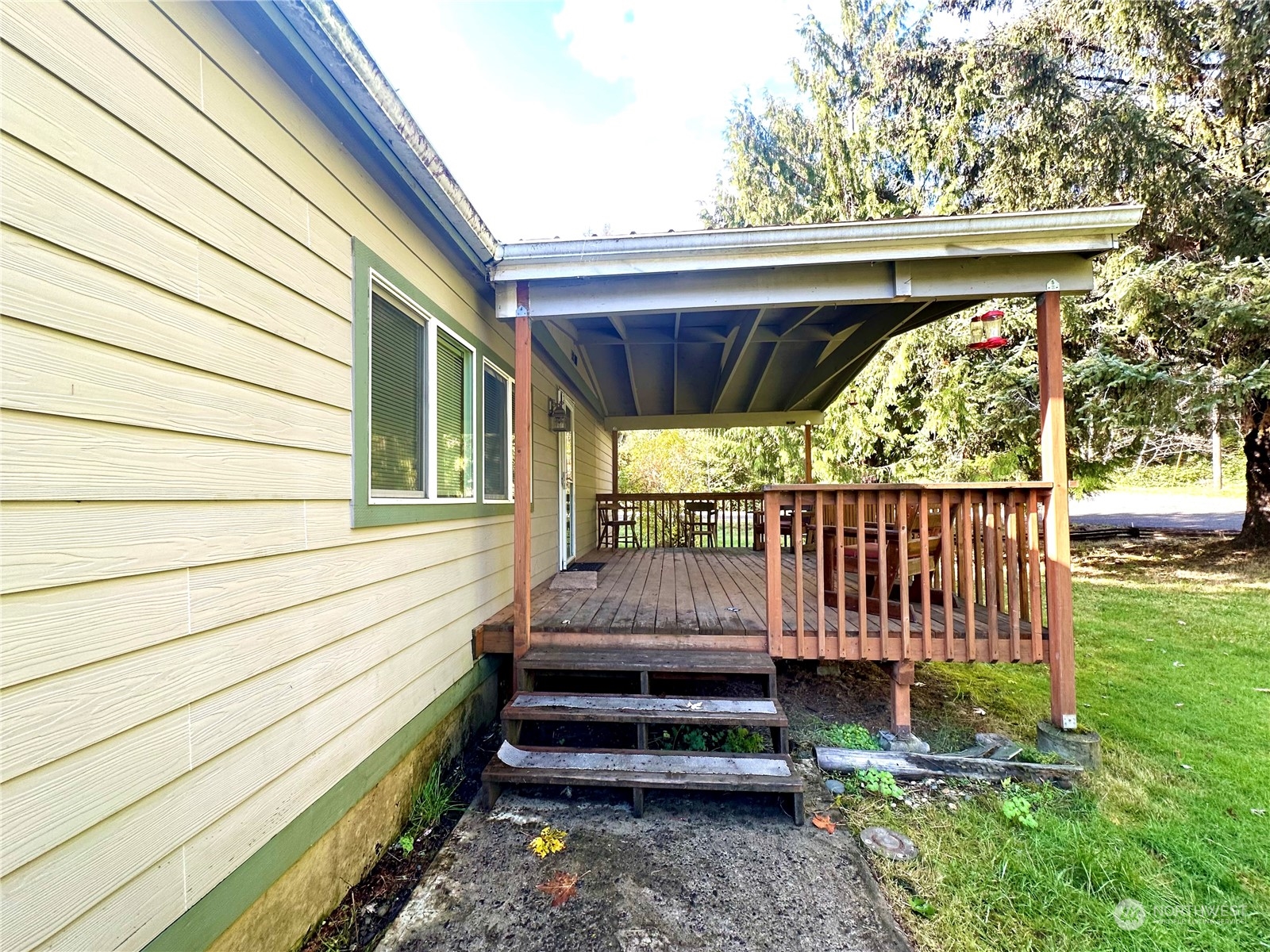 230 Salmon Drive Forks, WA 98331 - Photo 2 of 35 a view of a backyard with wooden fence and a bench